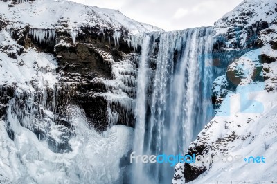 View Of Skogafoss Waterfall In Winter Stock Photo
