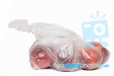 View Of Some Peaches Inside A Plastic Bag Stock Photo