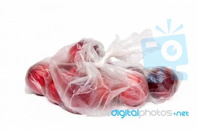 View Of Some Plums Inside A Plastic Bag Stock Photo