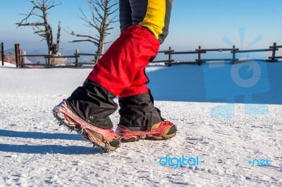 View Of Walking On Snow With Snow Shoes And Shoe Spikes In Winte… Stock Photo