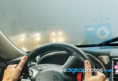 View Through The Cars Windshield  In The Winter Fog On The Road Stock Photo