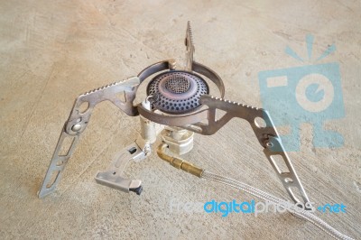 Vintage Camping Gas Stove On Grunge Floor Stock Photo