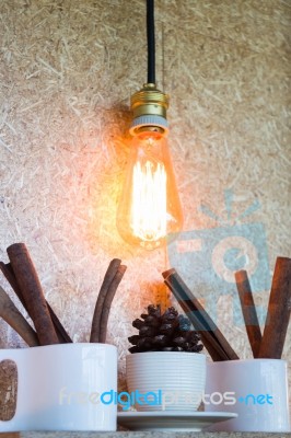 Vintage Hanging Light Bulb Decorated On Brown Wall Stock Photo