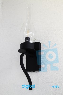 Vintage Light Bulb On Grunge Wall Stock Photo