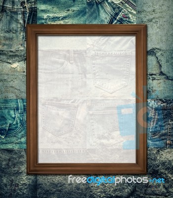 Vintage Picture Frame On Collage Rotten Jeans Stock Photo
