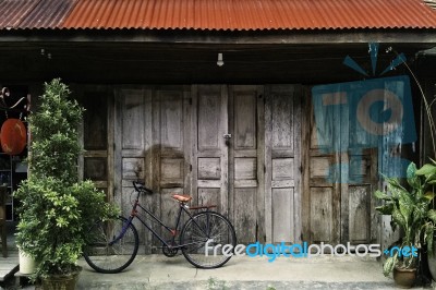 Vintage Retro Wood Door House With Bicycle Stock Photo