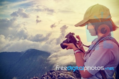 Vintage Style Hiker Looking Photo On Camera Stock Photo Vintage Style Hiker Looking Photo On Camera Stock Photo