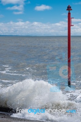 Warning Lamp In The Sea At Lyme Regis Stock Photo