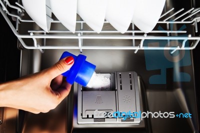 Washer Powder Pouring Into A Modern Dishwasher Stock Photo