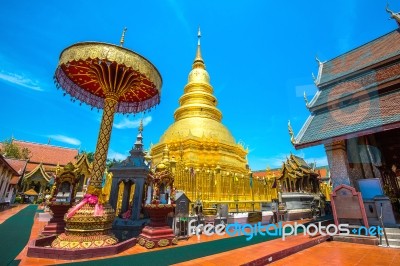 Wat Phrathat Hariphunchai Golden Pagoda In Lamphun,thailand Stock Photo