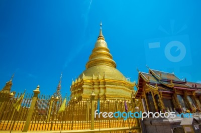 Wat Phrathat Hariphunchai Golden Pagoda In Lamphun,thailand Stock Photo
