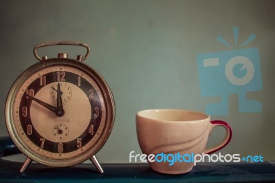 Watch And Cup On  Vintage Background Stock Photo