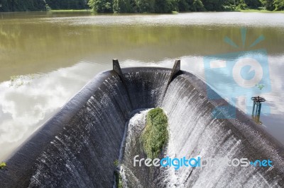 Water Flowing From Dam Stock Photo