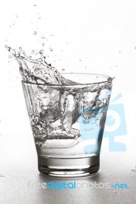 Water Splash In Glass Stock Photo
