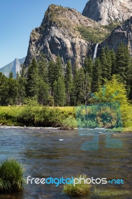 Waterfall And The Merced River  In Yosemite On A Summer's Day Stock Photo