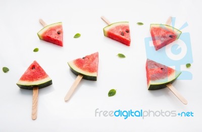 Watermelon Slice Popsicles And Paper Mint On White Wooden Backgr… Stock Photo