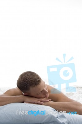 Weary Man Sleeping On Bed Stock Photo
