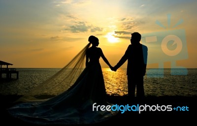 Wedding Couple At Sunset Stock Photo