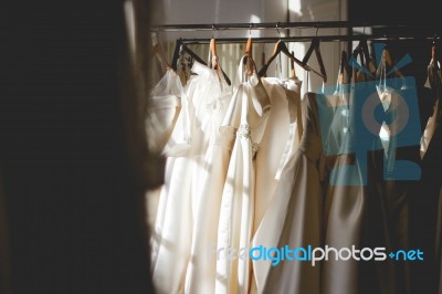Wedding Dresses In A Closet Stock Photo