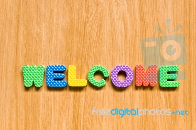 Welcome Letters Fixed On Wooden Board  Stock Photo