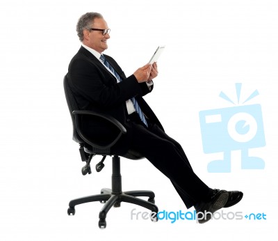 Well Dressed Corporate Male Holding Wireless Tablet Stock Photo