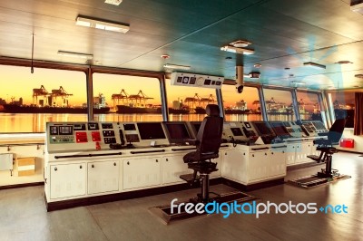 Wheelhouse Control Board Of Modern Industry Ship Approaching To Harbor At Night Stock Photo