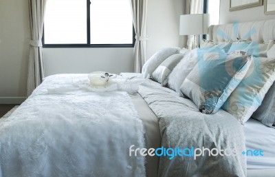 White And Grey Pillow On Bed Stock Photo