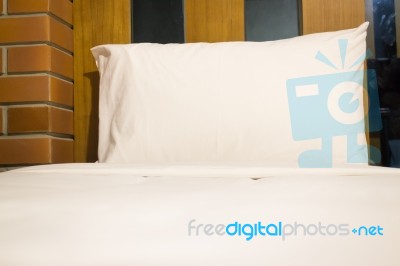 White Bedding Sheet And Pillow Stock Photo