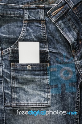 White Card On Blue Jeans Stock Photo