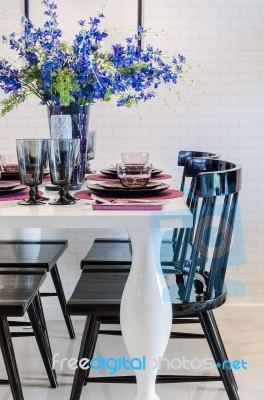 White Dinning Table With Black Chair In Dinning Room Stock Photo