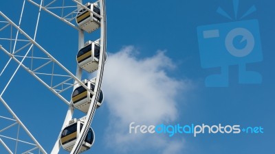 White Ferris Wheel Cloud And Blue Sky Stock Photo