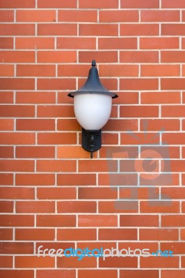 White Lamp Red Brick Wall Stock Photo