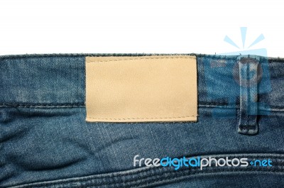 White Leather Label On Jeans Isolated On White Stock Photo