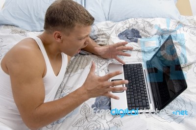 White Man Working On Laptop Stock Photo