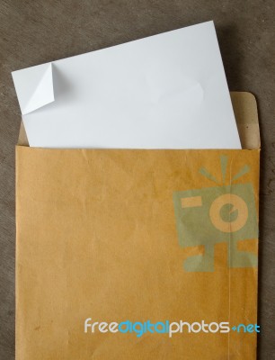 White Paper From A Brown Open Envelope Stock Photo