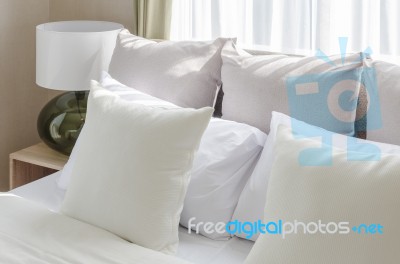 White Pillows On Bed In Modern Bedroom Stock Photo