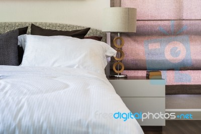 White Pillows With White Blanket On Modern Bedroom Stock Photo