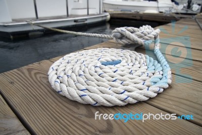 White Rope With Mooring Bollard Stock Photo