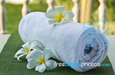 White Towel With Flower Stock Photo