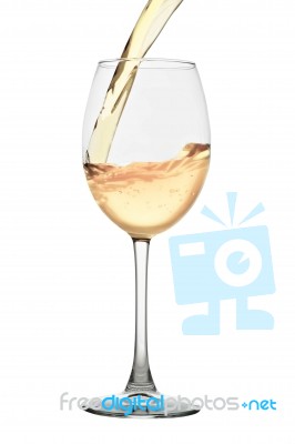 White Wine Pouring Into A Glass Isolated On White Stock Photo