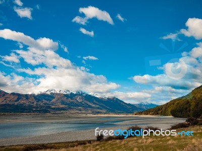 Wilderness With Mountains Trees And River Stock Photo