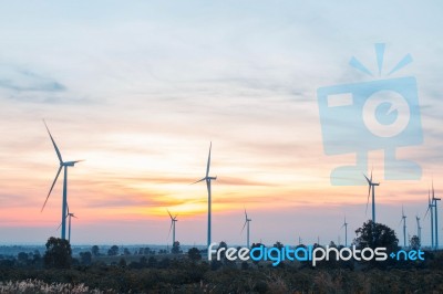 Wind Turbine At Sunrise Stock Photo