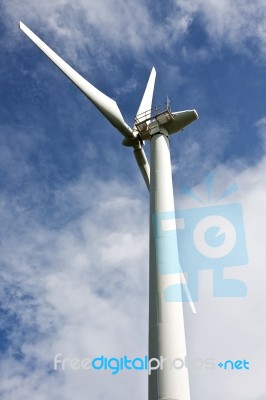 Wind Turbine In Cloudy Stock Photo