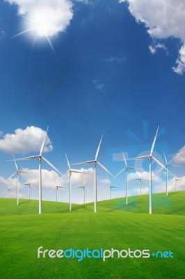 Wind Turbine On Green Grass Field Stock Photo