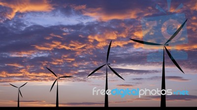 Wind Turbine Silhouette Sunset Or Sunrise Economic System Backg Stock Photo