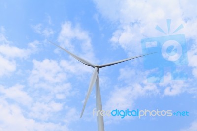 Wind Turbine With Blue Sky Closeup Stock Photo