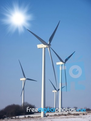 Wind Turbine With Sun Stock Image