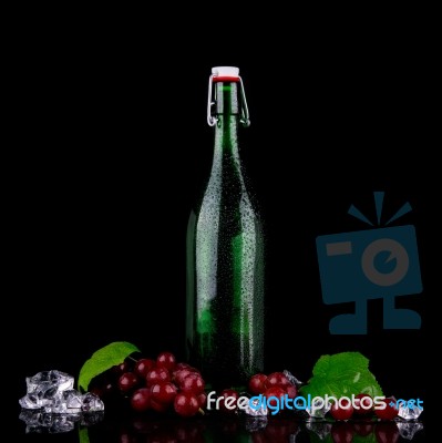 Wine Bottle With Red Grape Stock Photo
