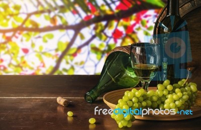 Wine Grapes On A Wooden Table Stock Photo