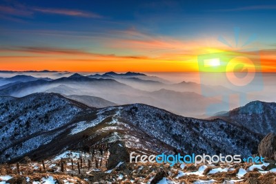 Winter Landscape With Sunset And Foggy In Deogyusan Mountains, South Korea Stock Photo